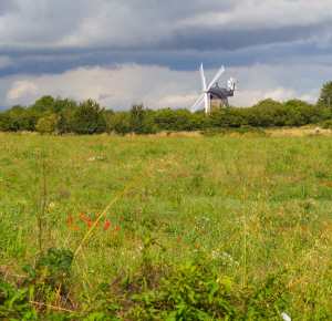 Wheatley windmill against stormy skies